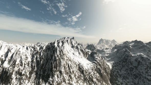 Mountains in Snow and Clouds at Blue Sky