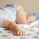 Beautiful Baby Sleeping in Funny Pose on a Bed. Under the Baby Diaper, the Boy About a Year - VideoHive Item for Sale