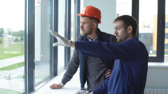 Cheerful Young Foreman Is Showing To the Architect the Problems of Construction