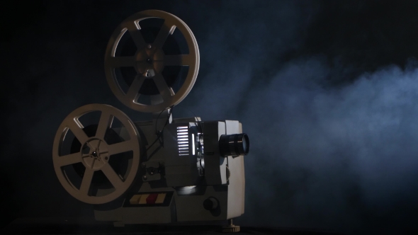 Projector Displays Movies in the Smoke. Black Background alt