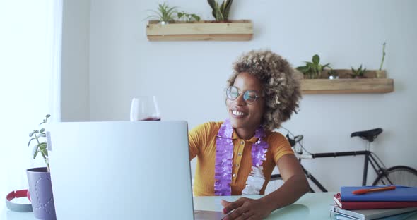 Woman Making a Video Call at Home and Toasting with a Glass of Wine