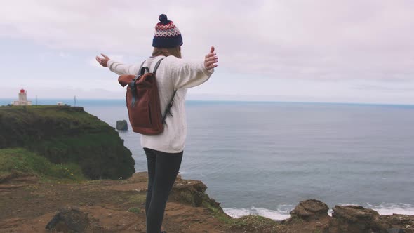 Back View of Young Attractive Girl Enjoing View of Mountain Landscape and Ocean Slow Motion