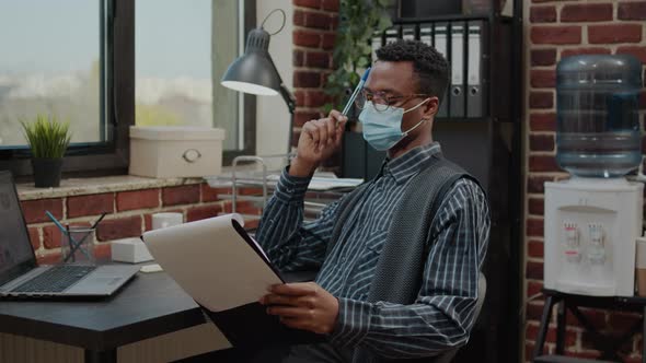 Pensive Man Thinking About New Business Strategy at Job