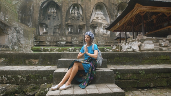 The Girl in a Blue Dress and a Skullcap at the Temple