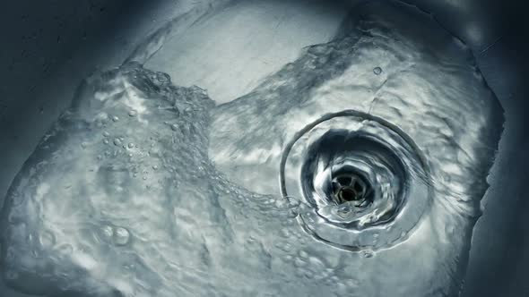 Water Runs Around Metal Sink