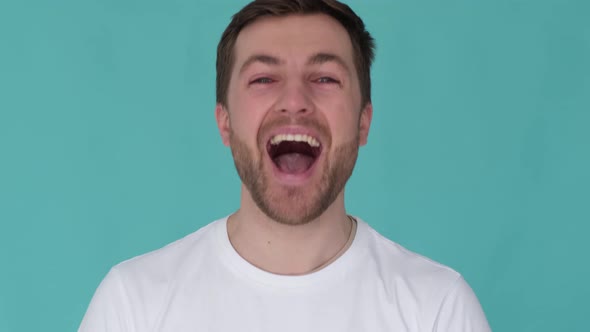 Close Up of a Man Shouting Into the Camera Lens with His Mouth Wide Open