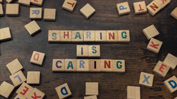 A Word SHARING IS CARING Made of Aligned Alphabet Letters Vocabulary Game Zoom in