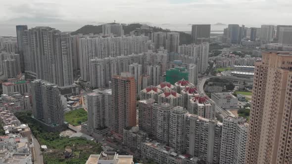 Aerial drone shot of Taipa highrise apartment buildings on cloudy day