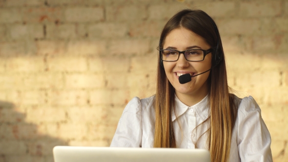 Beautiful Smiling Brunette Working in Call Center