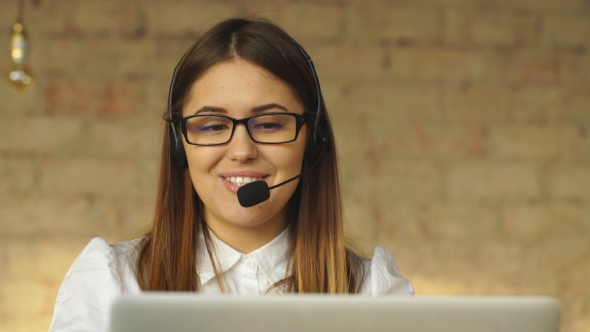 Beautiful Smiling Brunette Working in Call Center