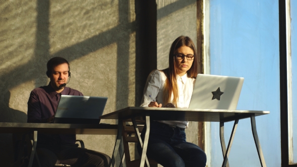 Two Customer Support Operator Working in a Call Center