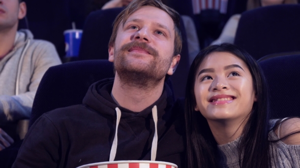 Couple Watches Romantic Film at the Movie Theater