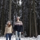 Couple Winter Snow Forest Walking Happy Smiling Man And Woman Holding Hands In Snowy Park - VideoHive Item for Sale