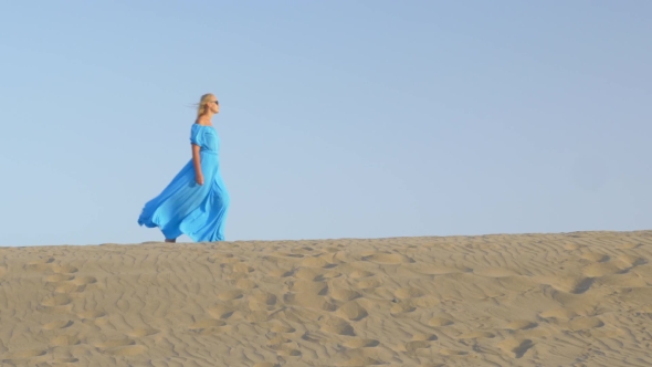 Woman Walking on Beach Skyline