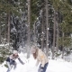 Couple Winter Forest Walking Man And Woman Throwing Snow Having Fun In Snowy Park - VideoHive Item for Sale