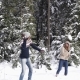Couple Winter Forest Walking Man And Woman Throwing Snow Having Fun In Snowy Park - VideoHive Item for Sale