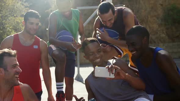 Basketball players taking a selfie