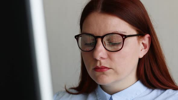 Focused Caucasian Businesswoman Working at the Computer Working Remotely at Home