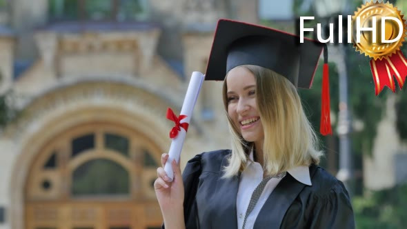 Graduand Woman in Mantle Shows Her Diploma