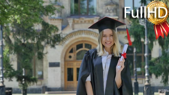 Woman in Mantle Raises Her Hands Shows Diploma