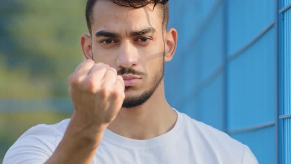Closeup Angry Disgruntled Aggressive Young Arabic Hispanic Male Athlete Student Shows Fist Looking