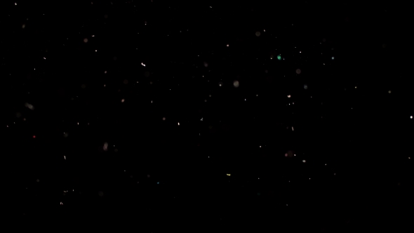Particles Flying on a Black Background. Colored Particles Flying Erratically. alt