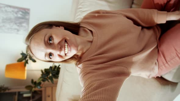 Joyous Woman Looking at Camera and Talking on Video Call from Home