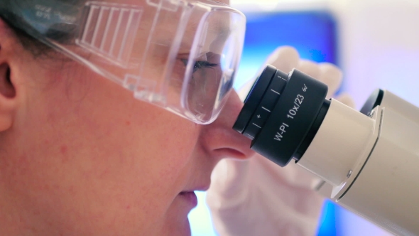 The Scientist Working with a Microscope alt