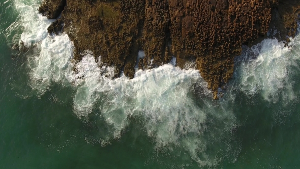 Movement and Splash of Waves Against the Rocks