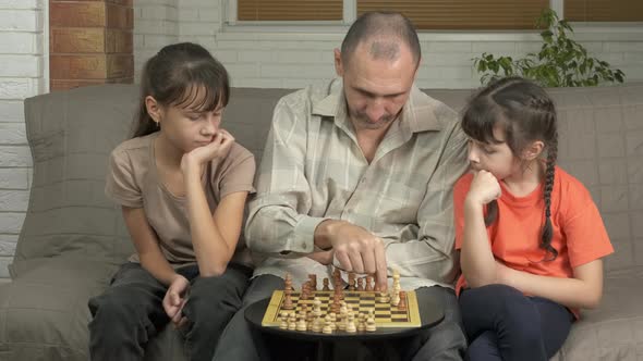 Getting Ready to Play Chess with Father