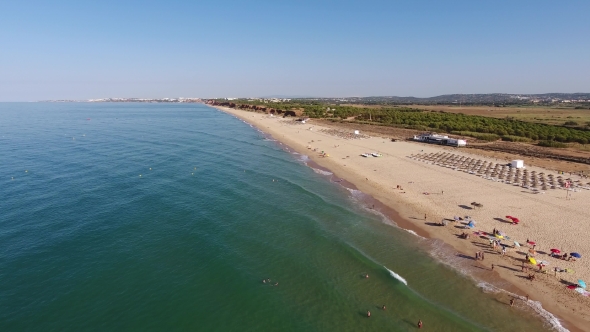 Falesia Beach, View From the Sky Sunbeds and Umbrellas To Tourists in the Summer.