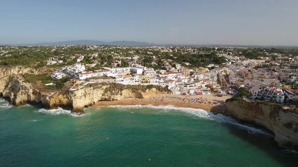 Aerial. Flying Over the Beach and the Tourist Village of Carvoeiro.