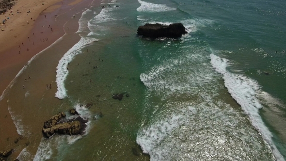Tonel Flight Over the Beach, with the Waves and Surfers