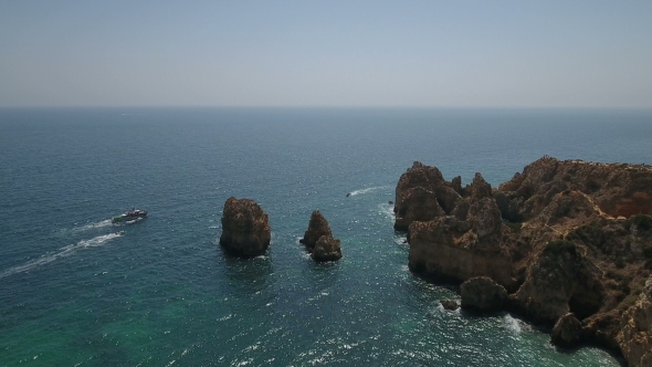 Ponta De Piedade Flying Over the Cliffs and Caves