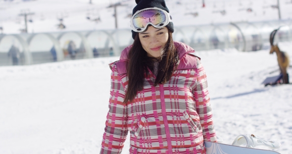 Cute and Happy Female Asian Snowboarder