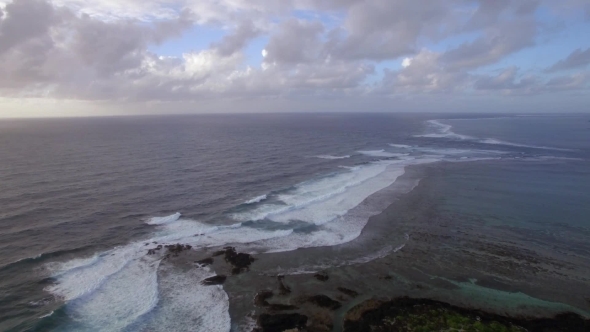 Aerial View of Water Line of Seas That Do Not Mix Against Blue Sky with Clouds, Mauritius Island