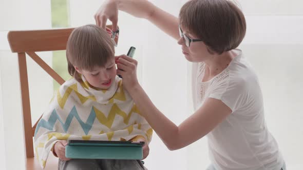 Mother Cuts Her Son's Hair By Herself