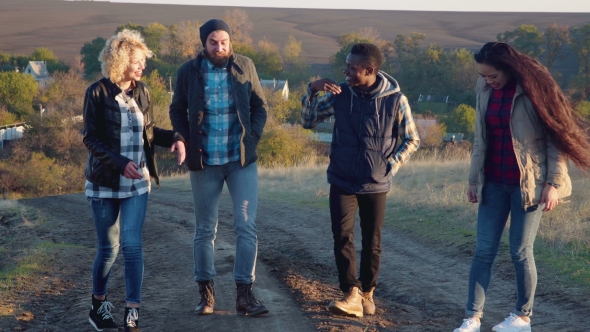 Happy Diverse Group Walking on Dirt Path