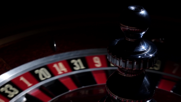 Roulette Wheel Running and Stops with White Ball on 20