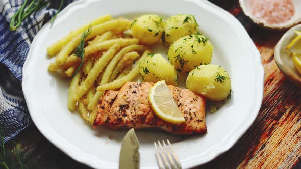 Fresh and Tasty Baked Salmon Served with Young Boiled Potatoes and Yellow Bean