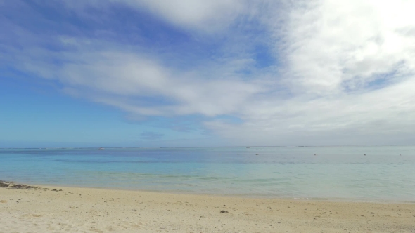 Beach with Deck-Chairs on Tropical Resort