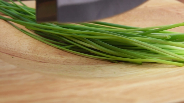 Sliced Green Onions on a Wooden Board