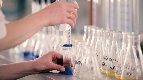 The Volumetric Flask Is Poured Into a Liquid. alt