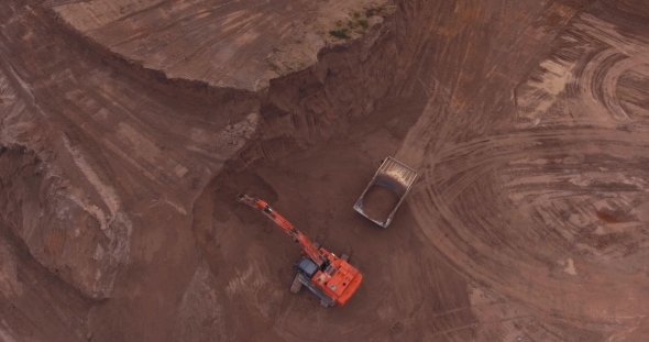 Loading Sand Excavating in Heavy Trucks