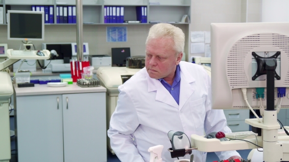 Man Controls Some Process at the Laboratory