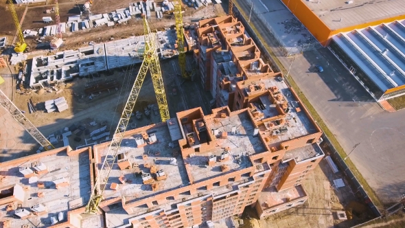 Construction Site with a Bird's Eye. Shooting with Drone. Building in the Field