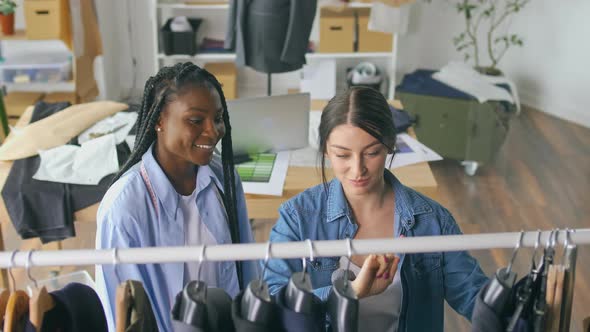 Successful Fashion Designers a Caucasian Woman and an AfricanAmerican Woman