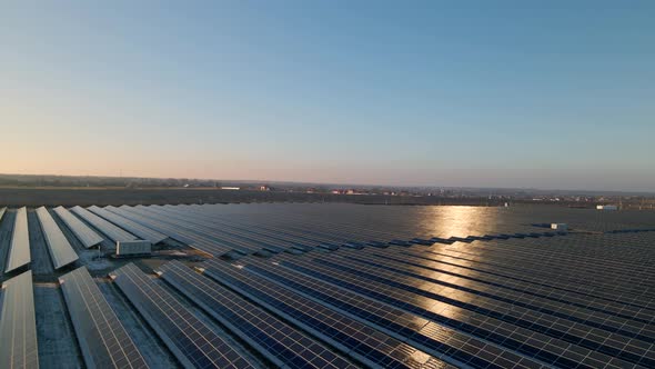 Aerial View of Solar Panels Stand in a Row in the Fields Power Ecology Innovation Nature Environment