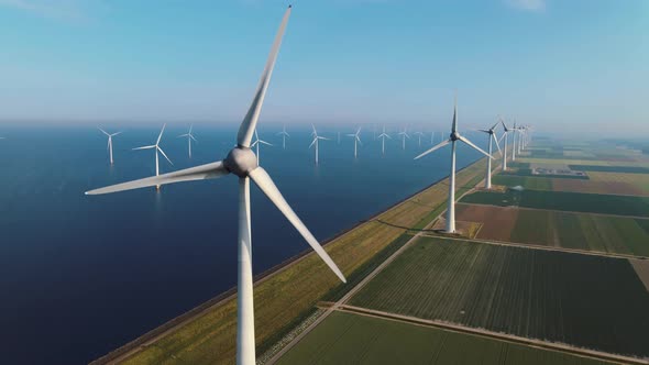 Offshore Windmill Park with Clouds and a Blue Sky Windmill Park in the Ocean Drone Aerial View with