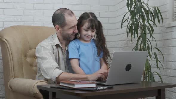 Father with a child in the home office. 